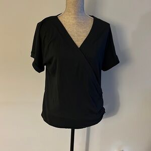 Soft Surroundings size large black crossover blouse with side button detail.